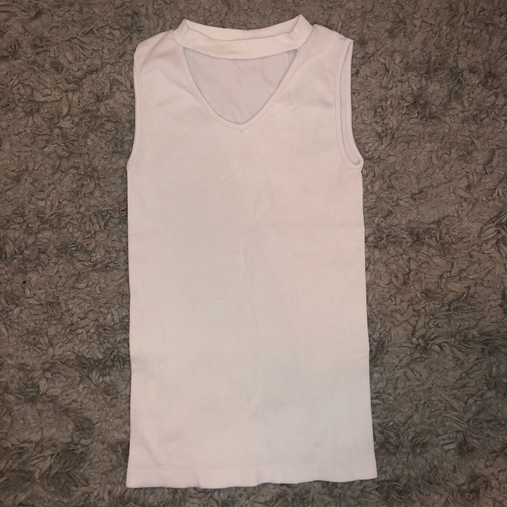 Fitted white tank top with a v-neck cut out